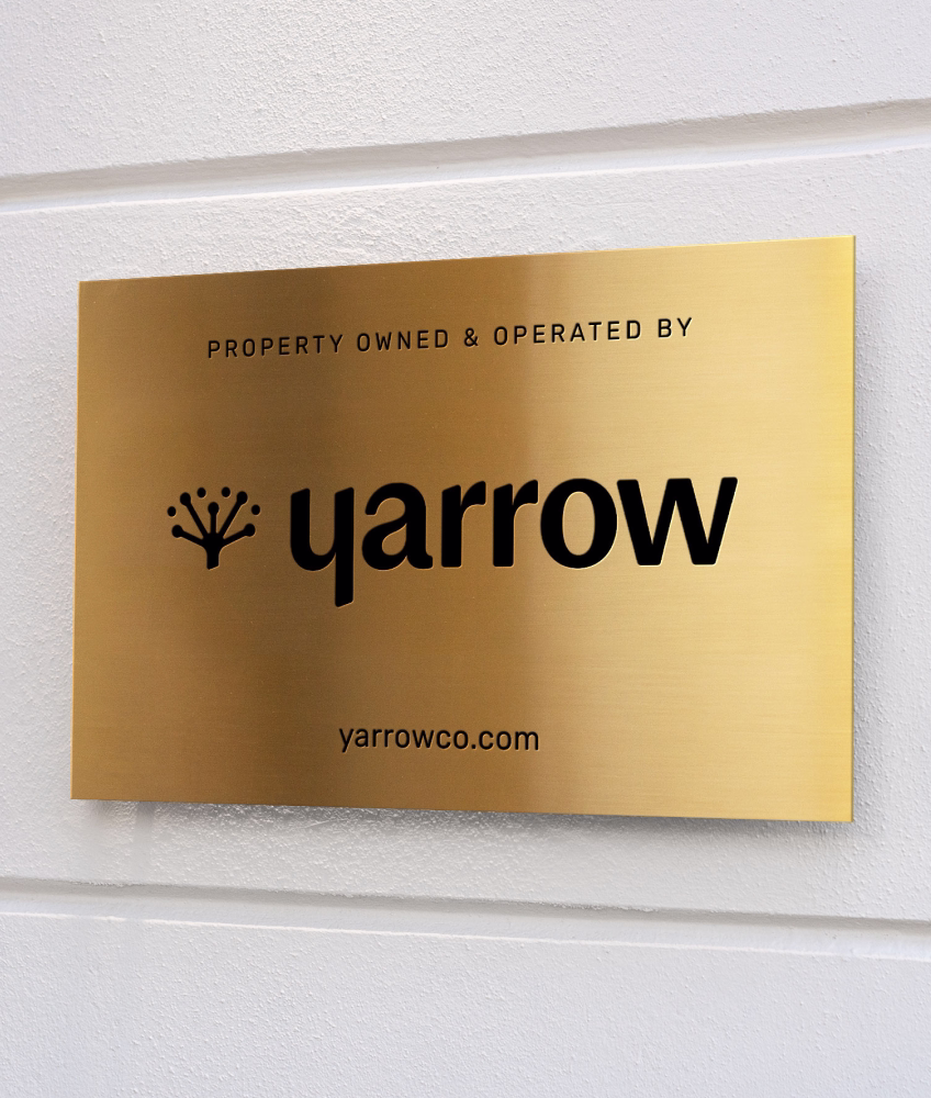 New Yarrow logo on metal sign - real estate branding case study