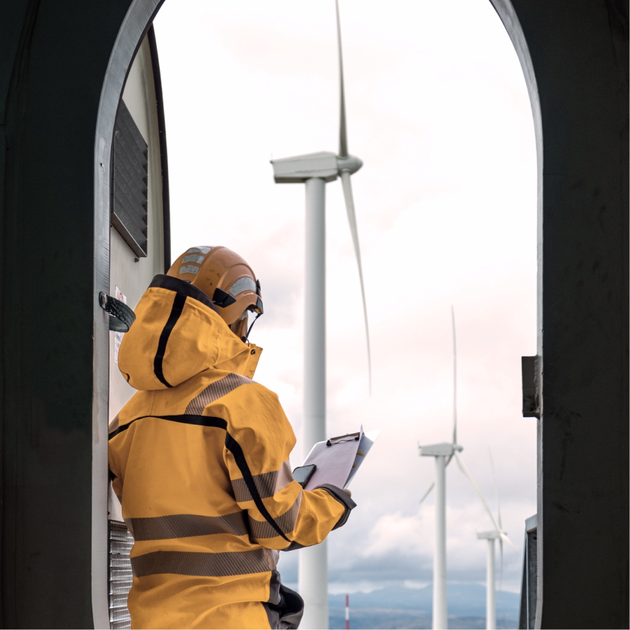 Image of technician working on a wind farm for a blog about clean energy messaging